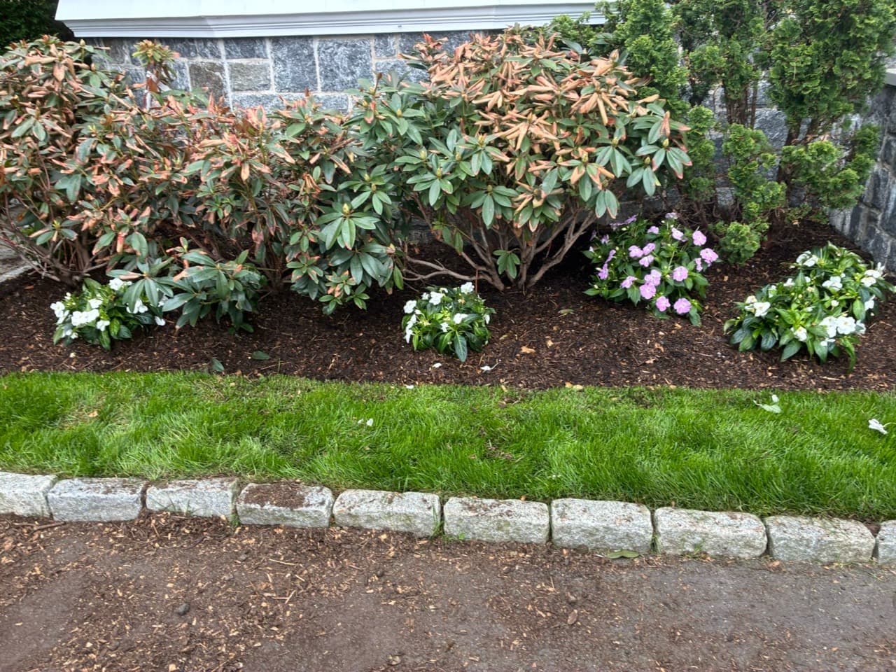 Crotty Landscaping flower bed refresh with fresh mulch and seasonal color